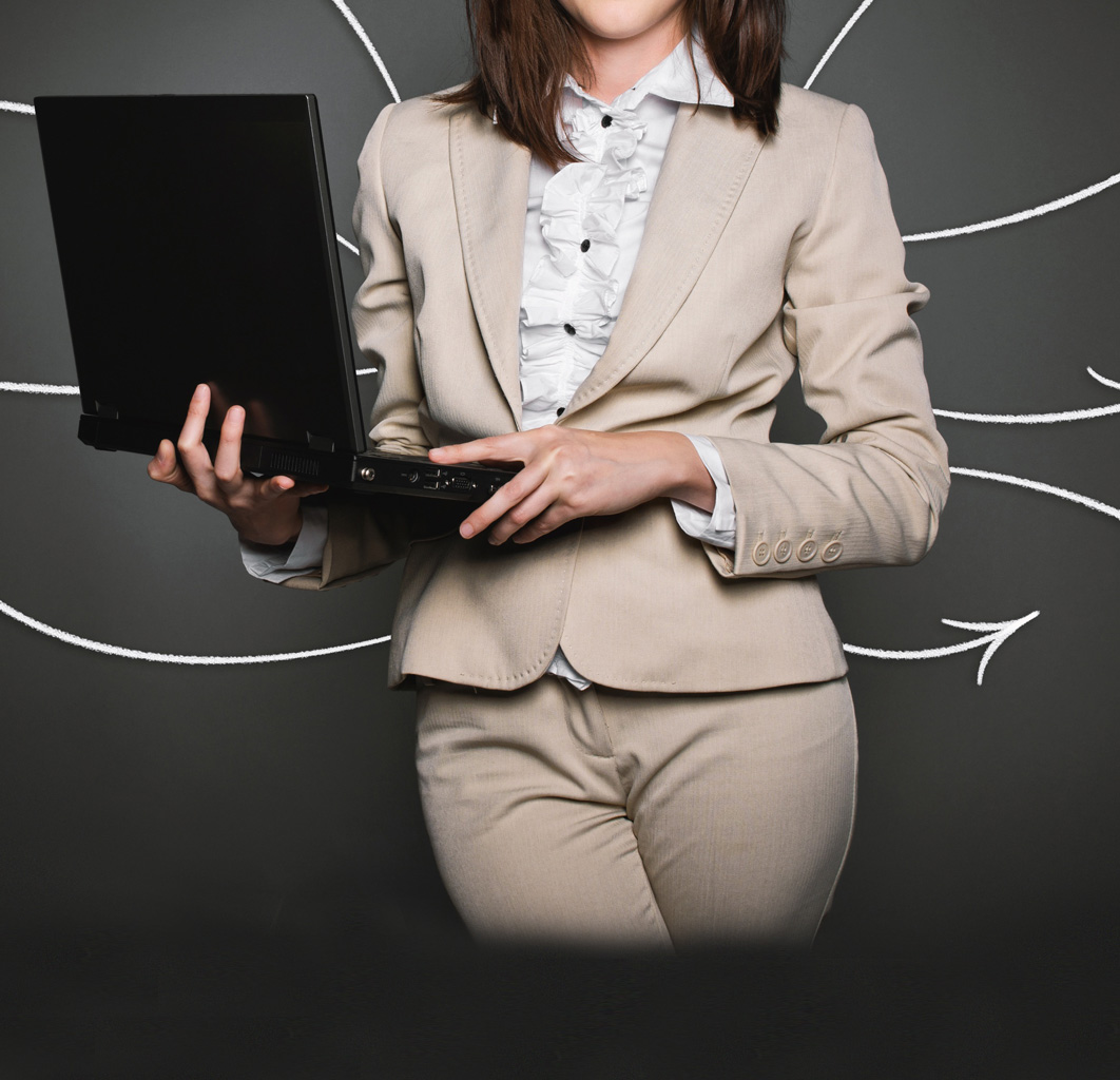 Woman holding a laptop with arrows around her.